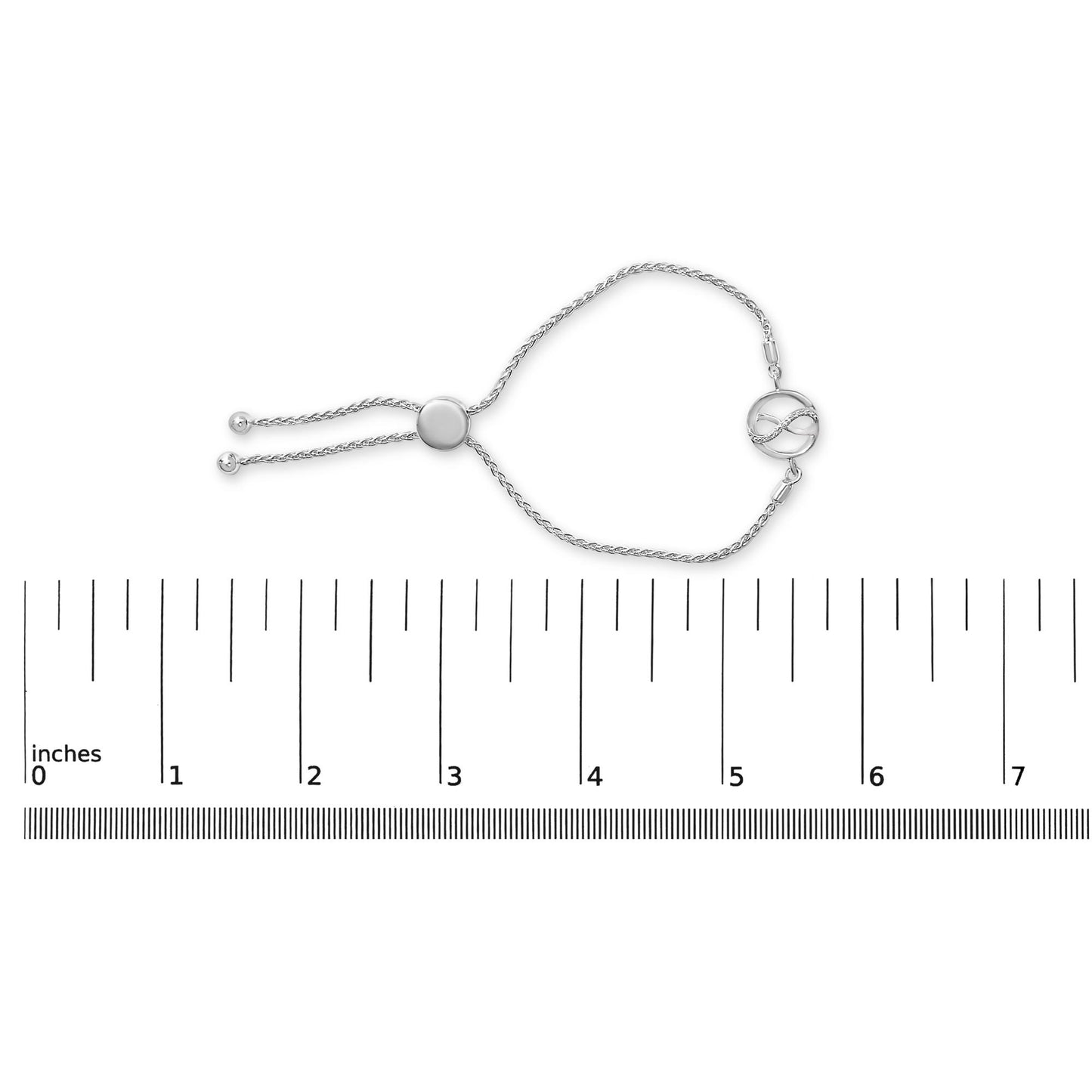 White-colored bracelet with an adjustable sliding closure featuring an infinity symbol accented with white gemstones, shown on a scale from a top-down angle.