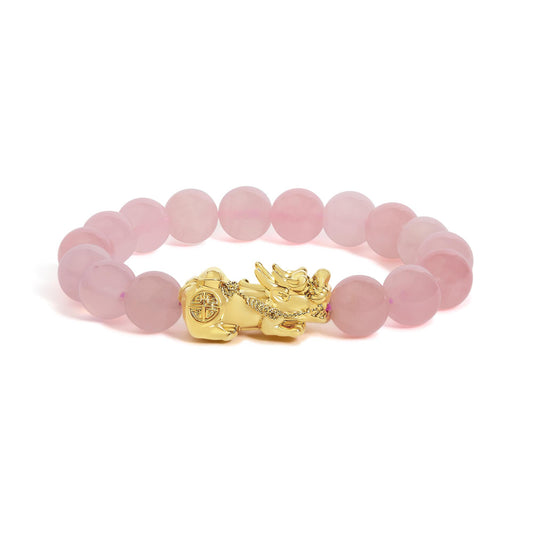 Close-up front angle of a circular bracelet featuring round pink gemstones with a yellow metal decorative element. The bracelet is shown on a white background.