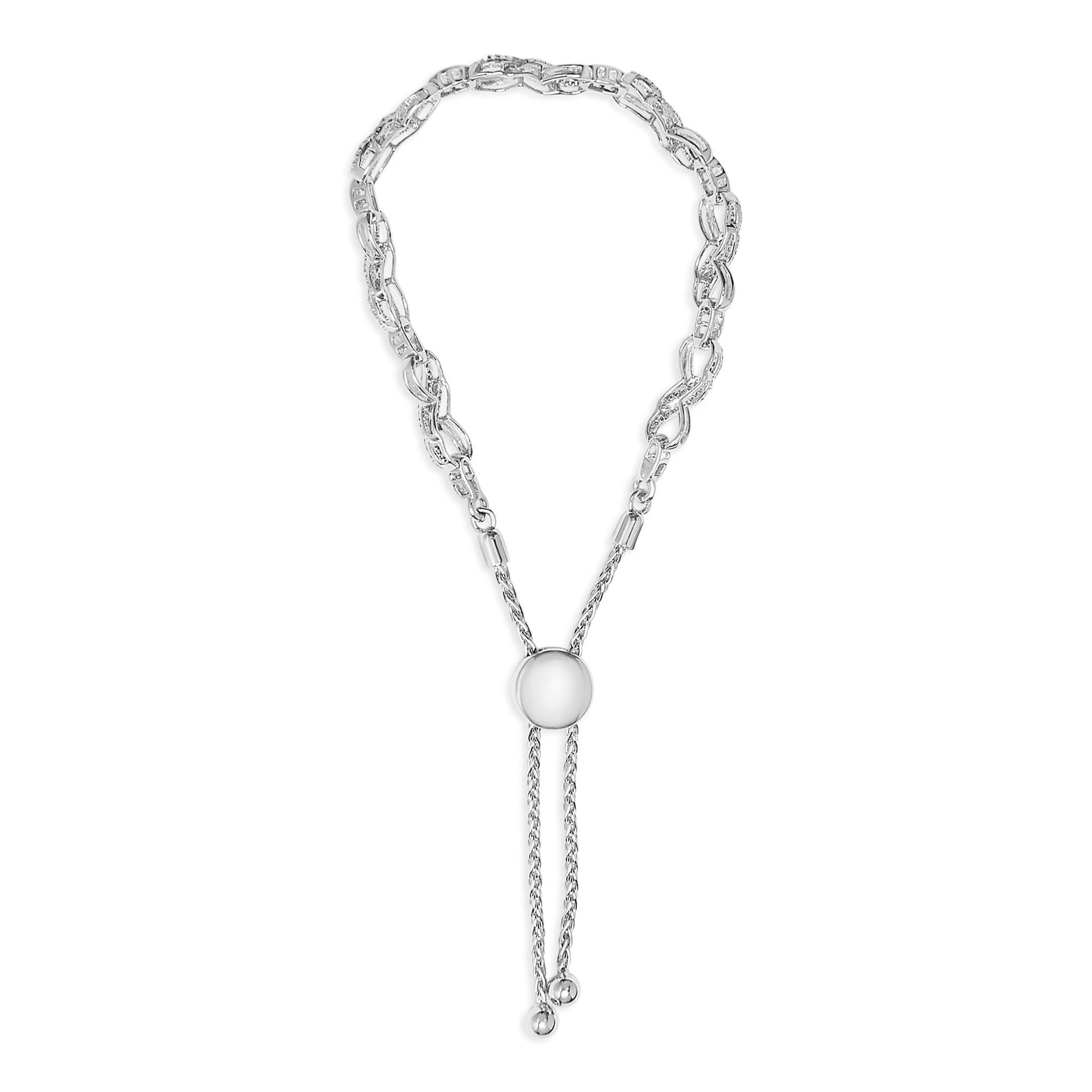 White metal bracelet with two linked chain styles; one section features larger links with white gemstones, shown from a top-down angle on a white background.