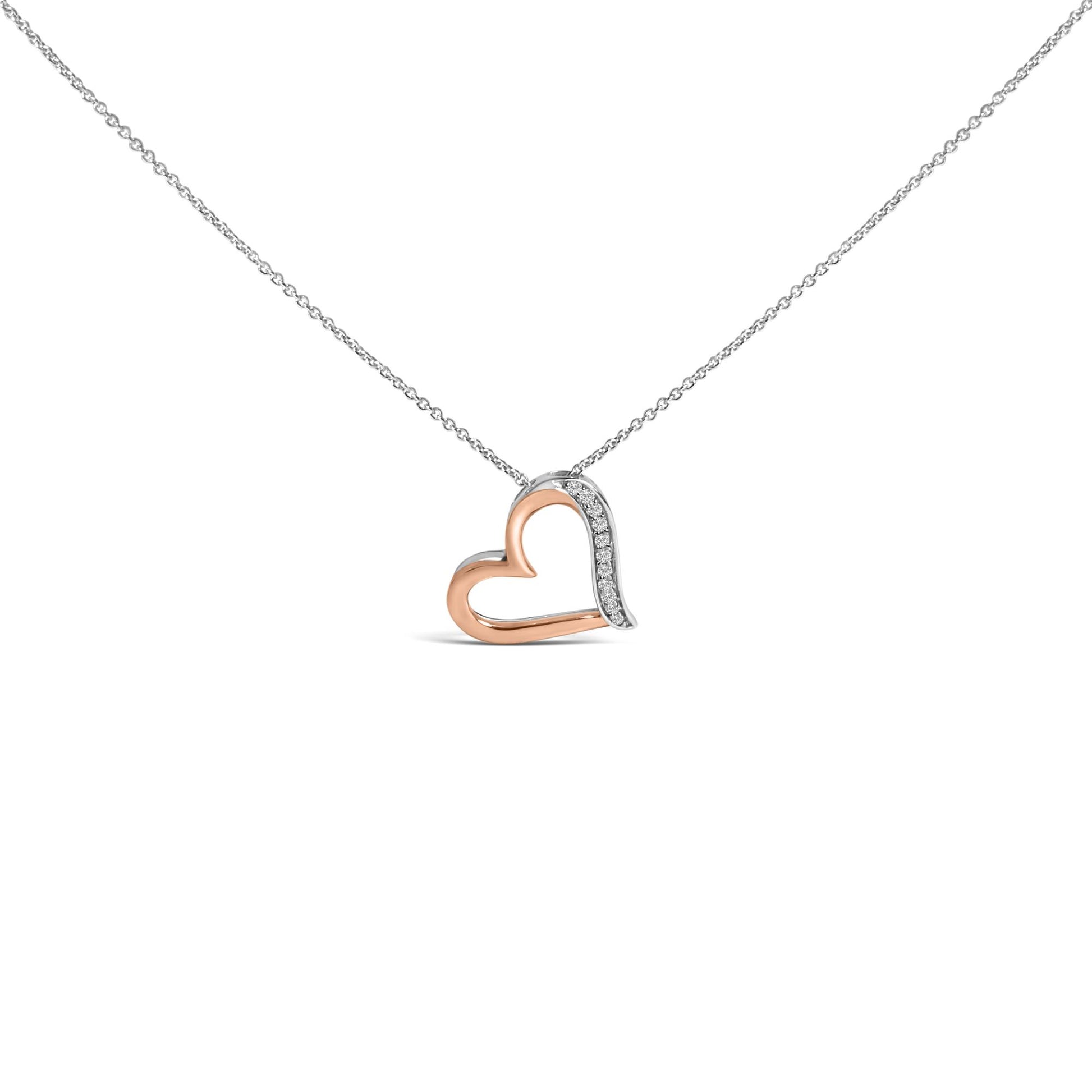 Front view of a heart-shaped necklace pendant with rose-colored and white sections, the white section adorned with round white gemstones in a pave setting, shown on a chain against a white background.