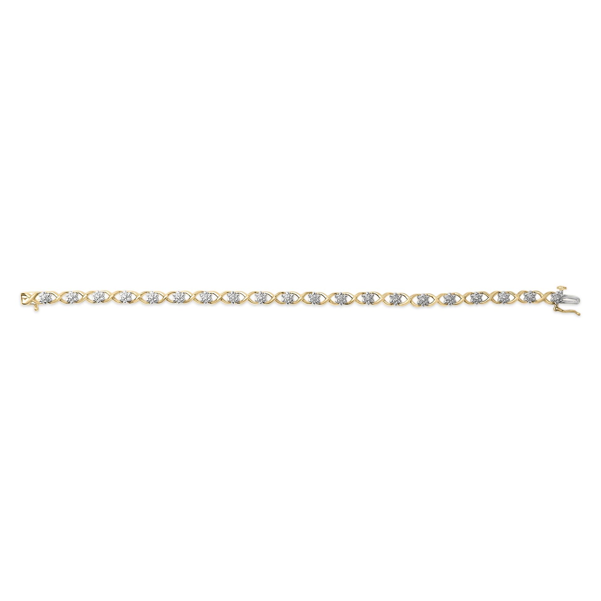 Straight-on shot of a yellow and white metal bracelet with an alternating crisscross design featuring round white gemstones in prong settings.