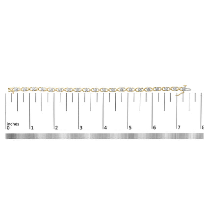 Bracelet with alternating yellow and white metal links, each set with round white gemstones in prong settings, shown flat on a scale from 0 to 8 inches, shot from above.