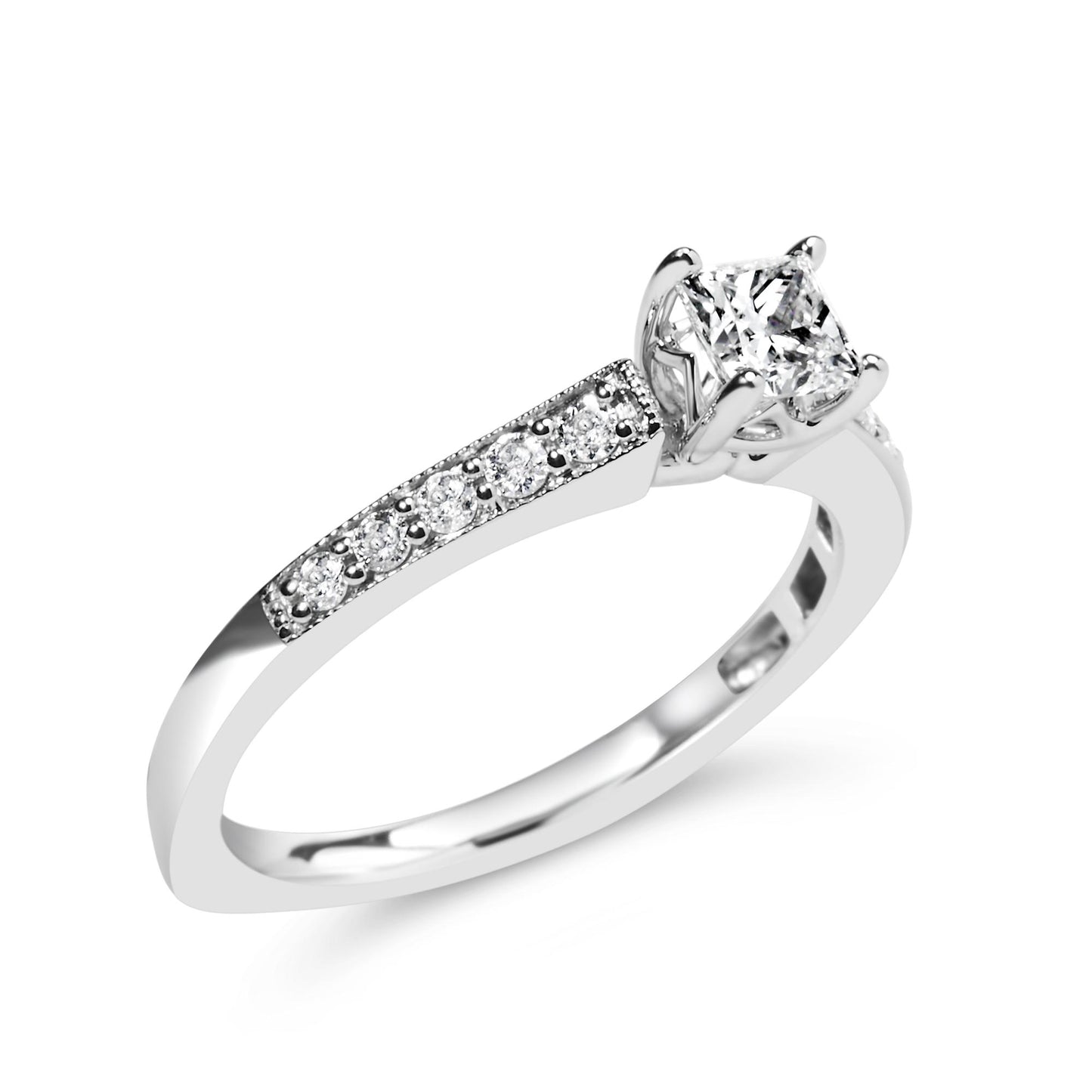 White metal ring with a princess-shaped white gemstone in a four-prong setting and round white gemstones in a shared prong setting along the band, shown at a slight angle.