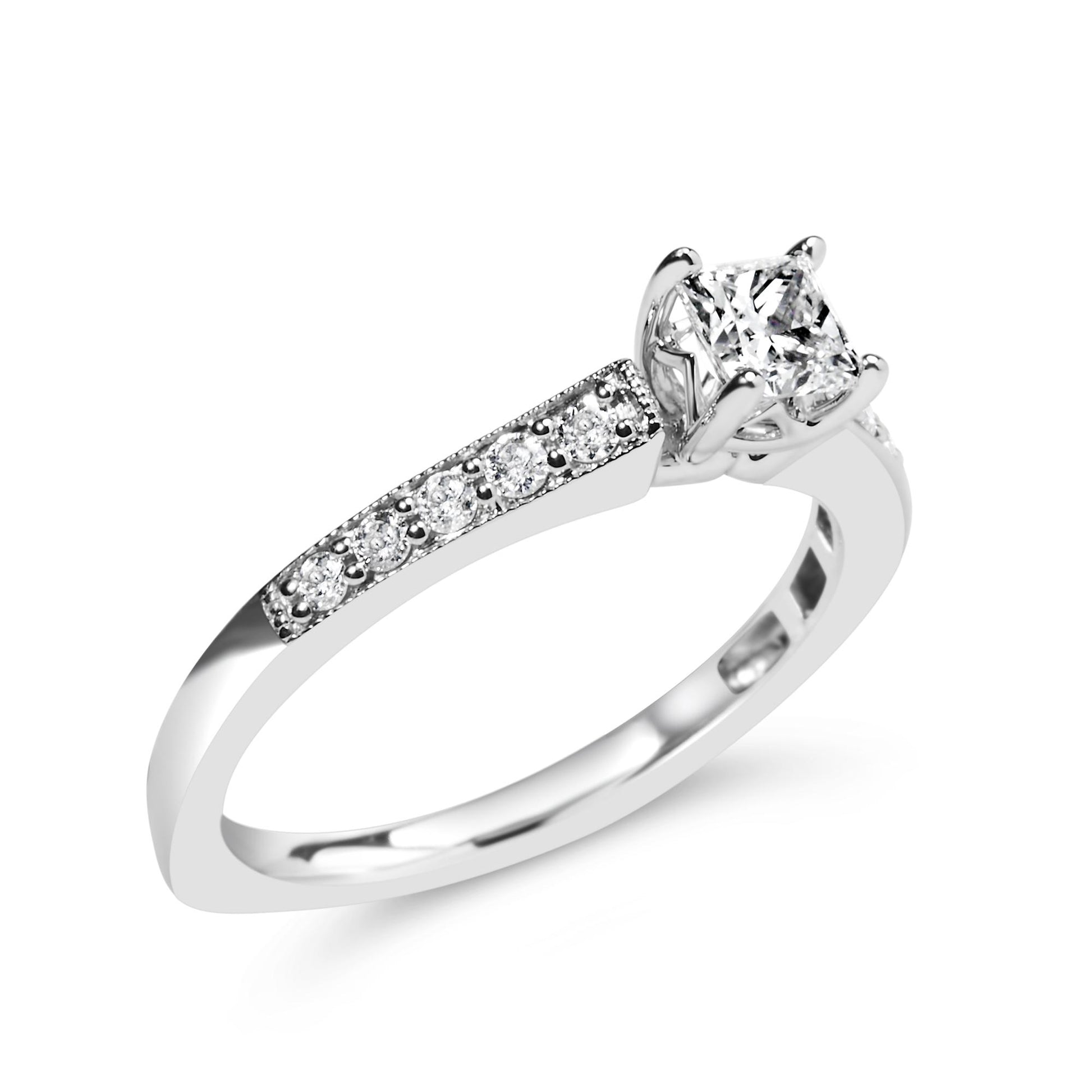 White metal ring with a princess-shaped white gemstone in a four-prong setting and round white gemstones in a shared prong setting along the band, shown at a slight angle.