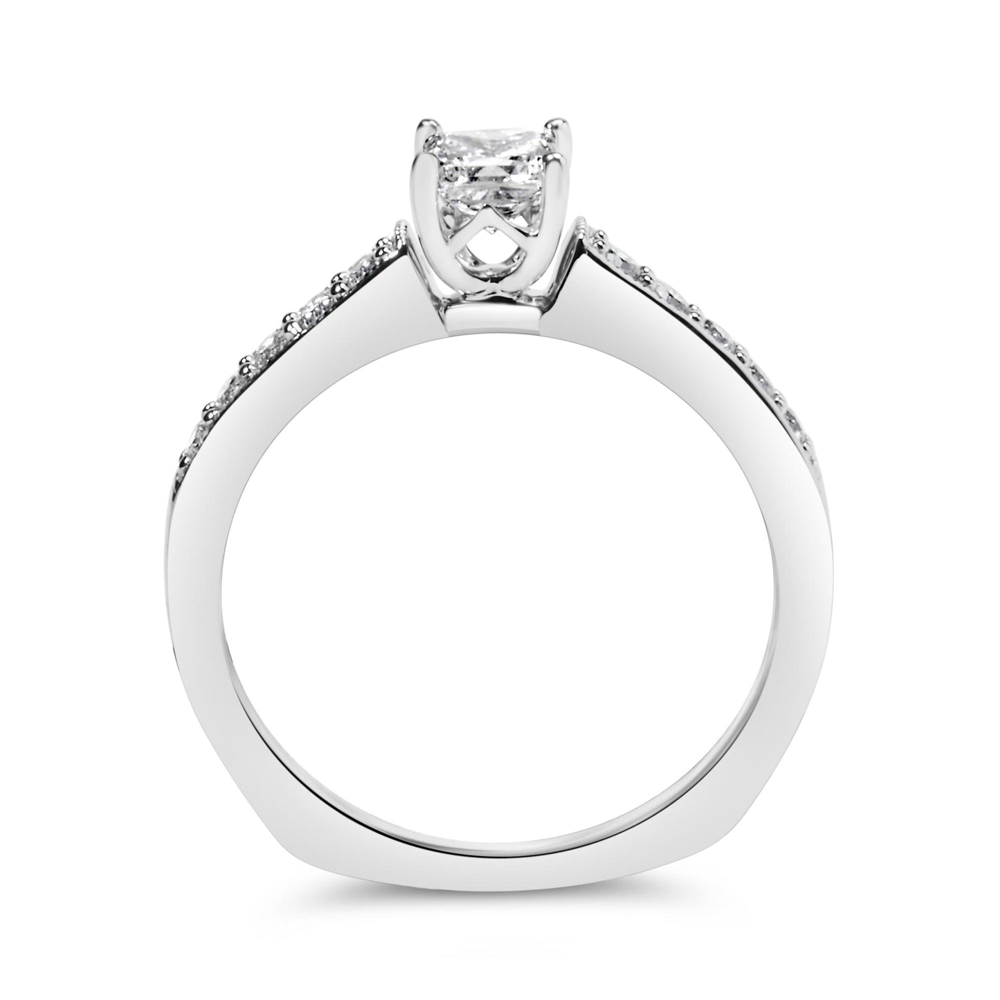 Side profile view of a white metal ring featuring a princess-shaped white gemstone in a 4-prong setting at the center and round white gemstones in a shared prong setting along the band.