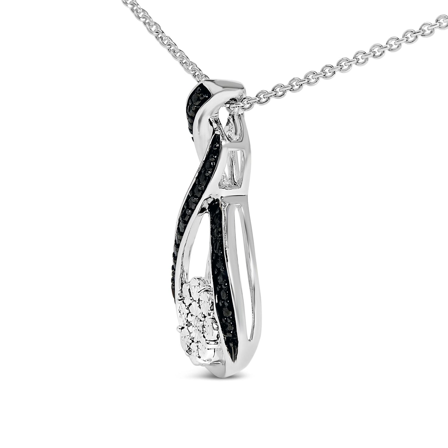Close-up angled view of a white and black necklace pendant featuring a twisted design with black pave-set round gemstones and a cluster of white round gemstones, hanging on a white chain.
