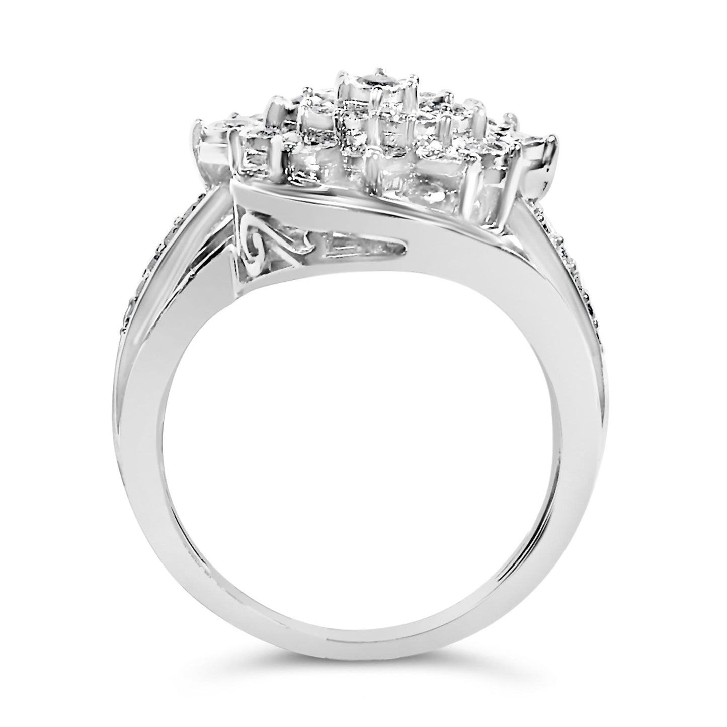 White metal ring shown from a side angle, featuring a cluster of white round gemstones in miracle setting on top and baguette-shaped white gemstones in channel setting on the band.