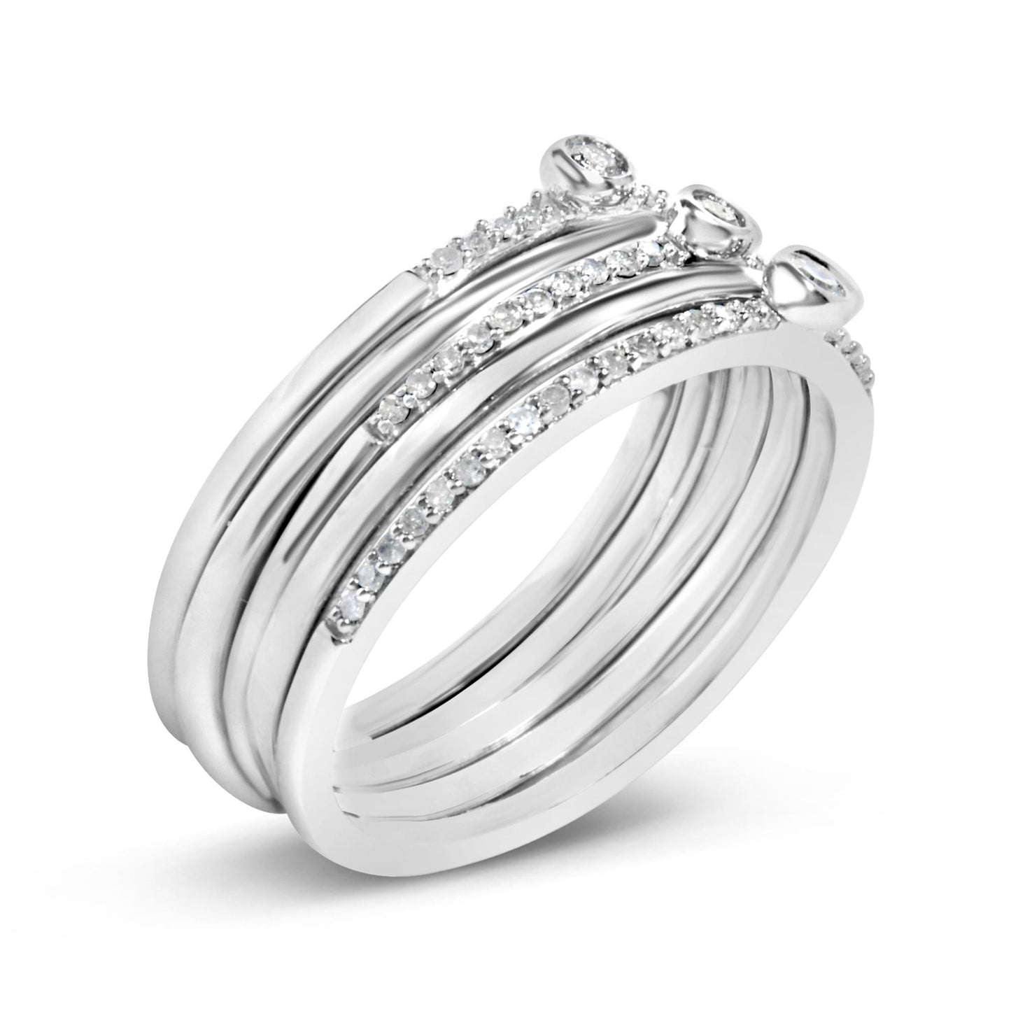 Close-up angled view of a white metal ring featuring five round white gemstones in bezel settings and multiple smaller round white gemstones in prong settings along the bands.