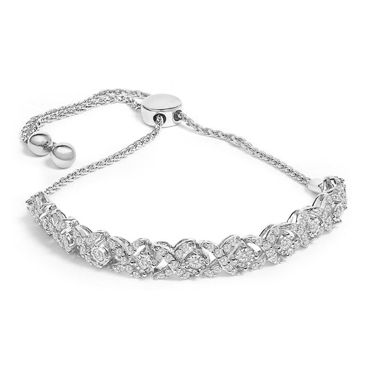 Bracelet with white metal chain and adjustable sliding clasp, featuring an intertwined design set with round white gemstones in a channel setting, shown against a white background from a top-front angle.