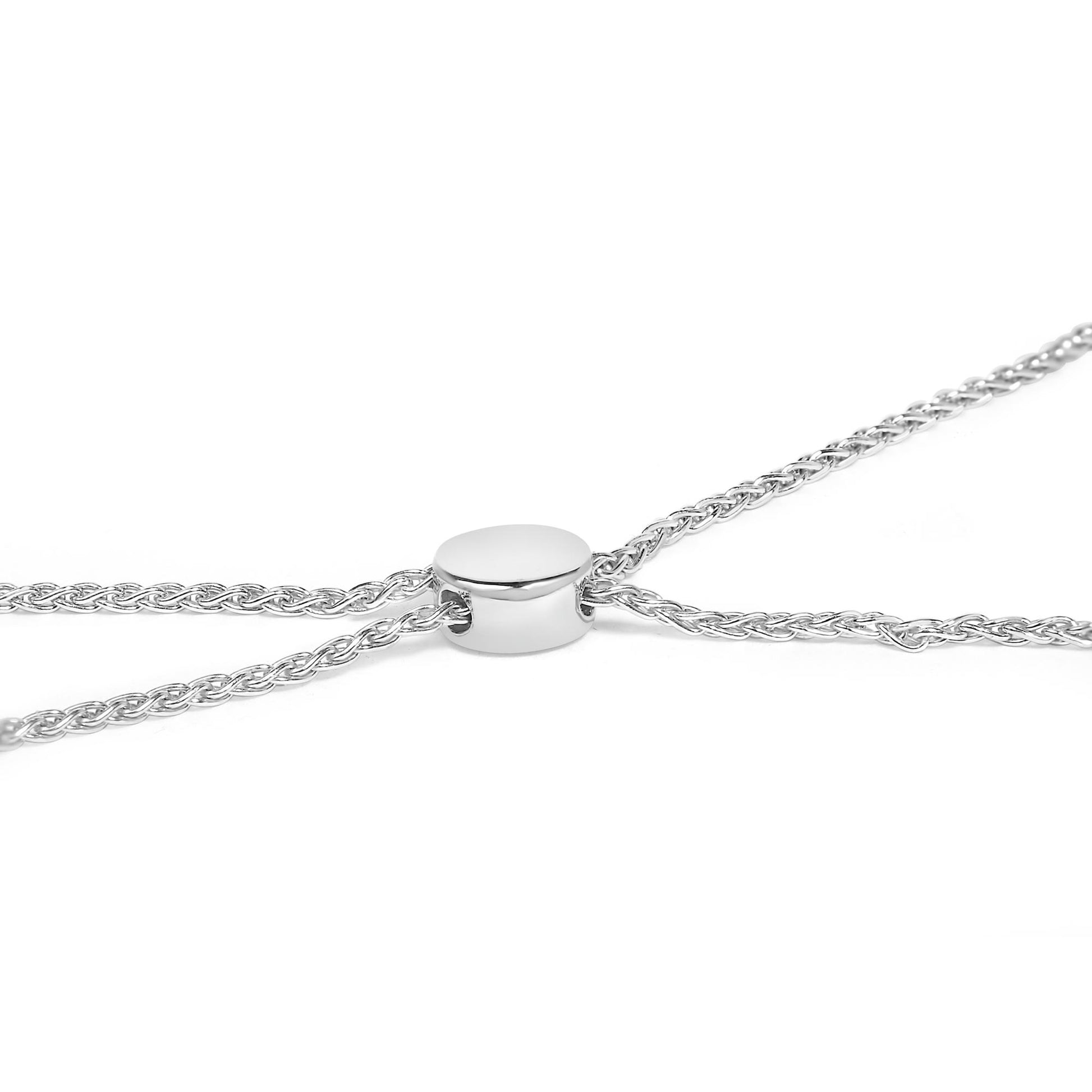 Close-up image of a white metal braided bracelet with a smooth round slider shown at an angle.