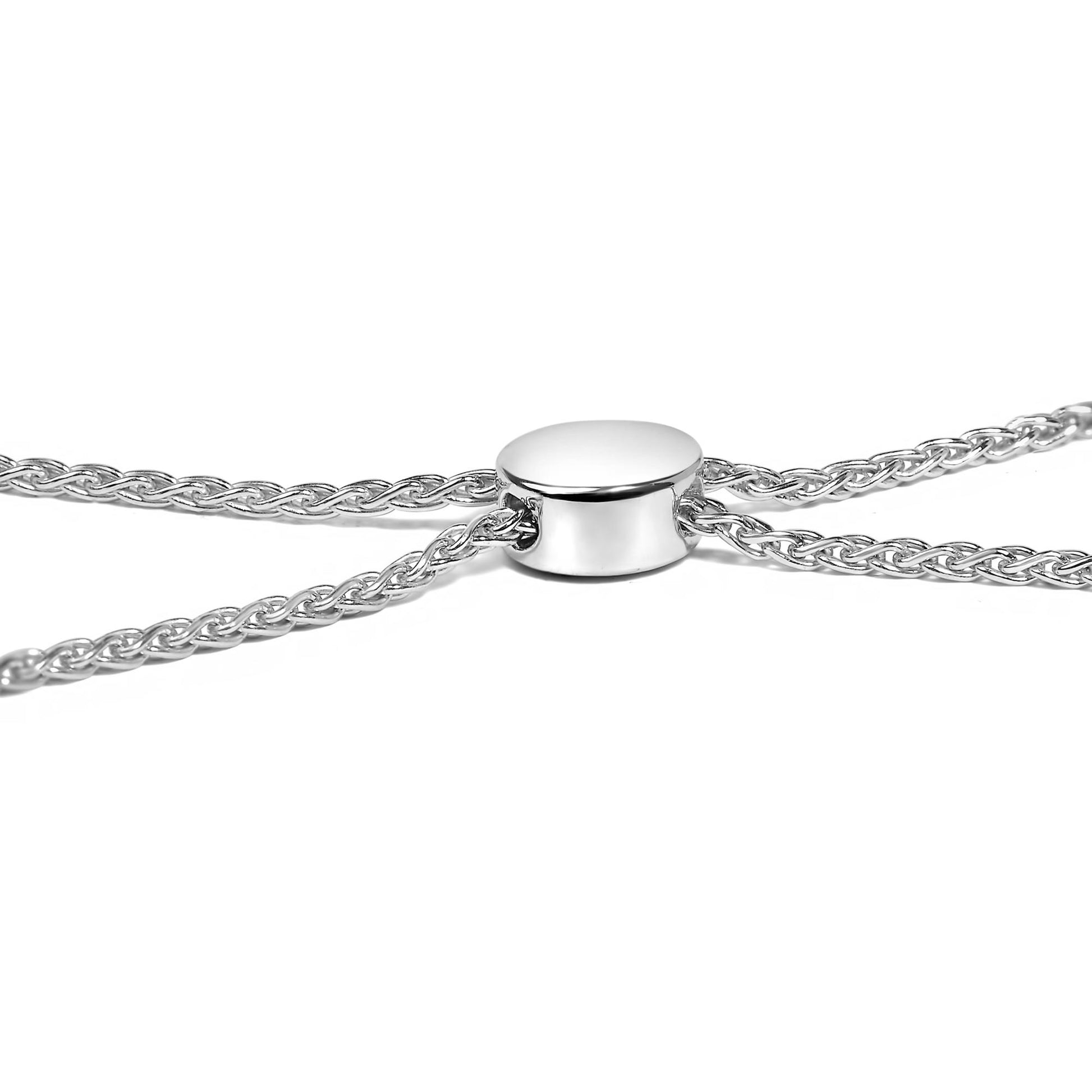 Close-up front angle of a white metal bracelet chain with a smooth circular slider.