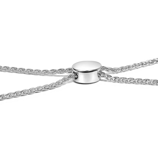 Close-up front angle of a white metal bracelet chain with a smooth circular slider.