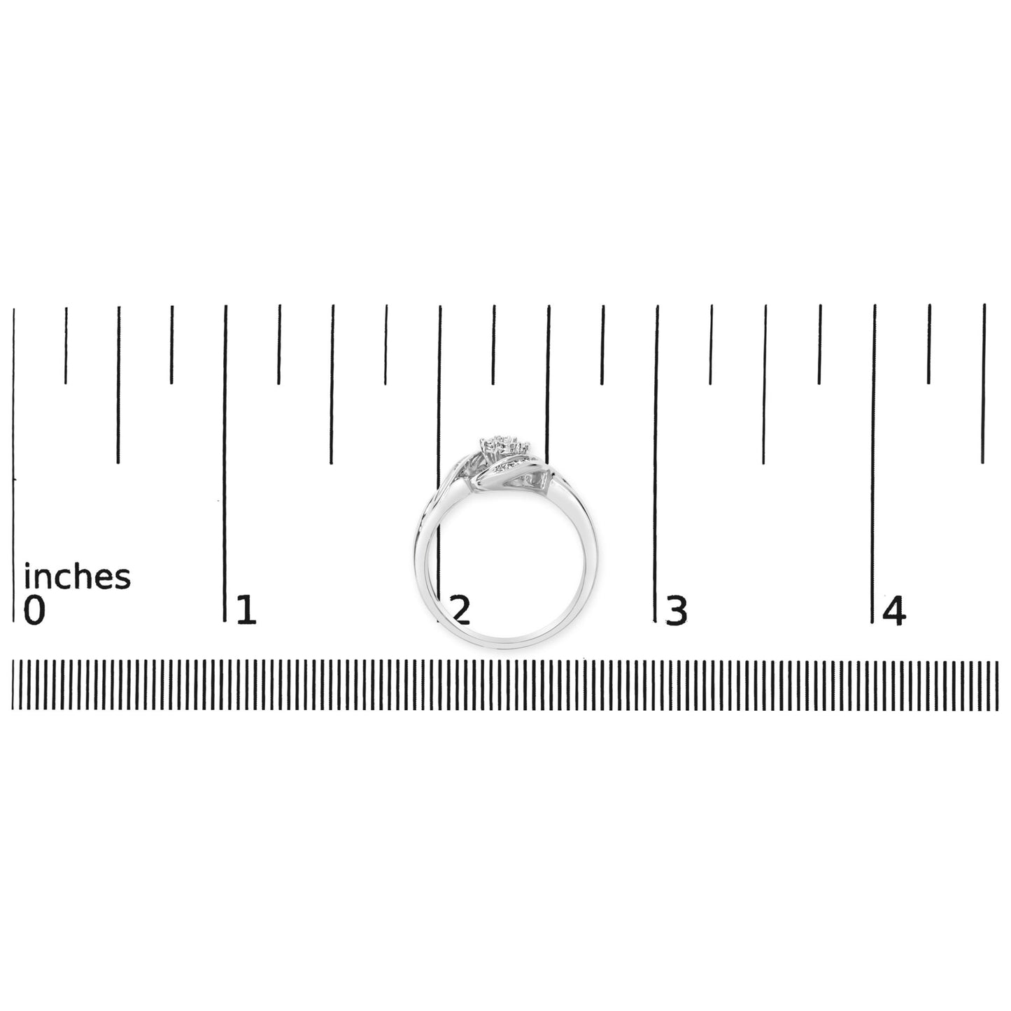 White ring with intertwined band design featuring white baguette and round gemstones, shown on a ruler scale from a side angle.