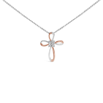 Front view of a white and rose colored metal cross-shaped necklace pendant with four round white gemstones in bezel settings at the center, shown against a white background.