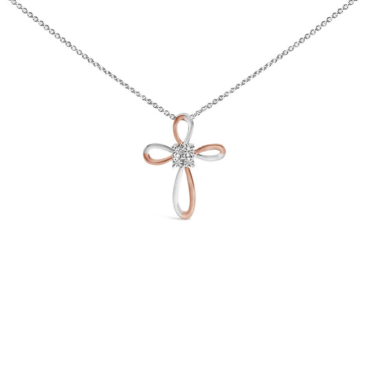 Front view of a white and rose colored metal cross-shaped necklace pendant with four round white gemstones in bezel settings at the center, shown against a white background.