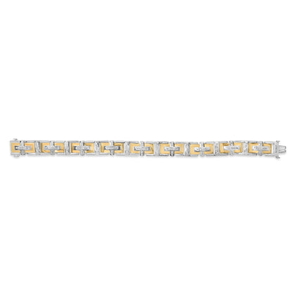 Top-down view of a two-tone bracelet featuring rectangular links with yellow and white metal tones, accented with small round white gemstones in a pave setting along the edges.