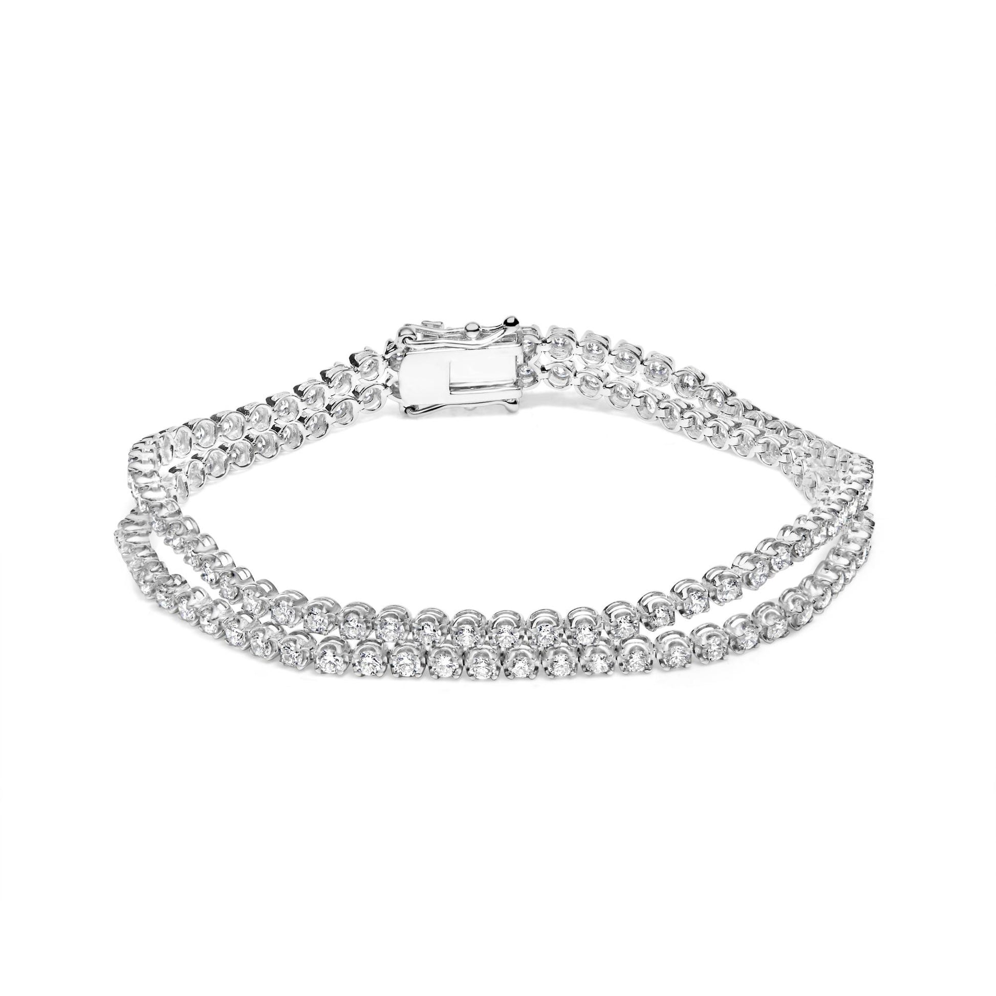 White metal double row bracelet with round white gemstones in 4-prong settings, shown from a front angle on a white background.