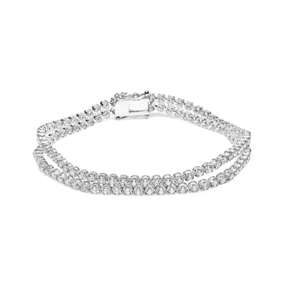 White metal double row bracelet with round white gemstones in 4-prong settings, shown from a front angle on a white background.