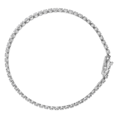 Top-down view of a white metal bracelet set with round white gemstones in four-prong settings along the entire length, featuring a clasp.