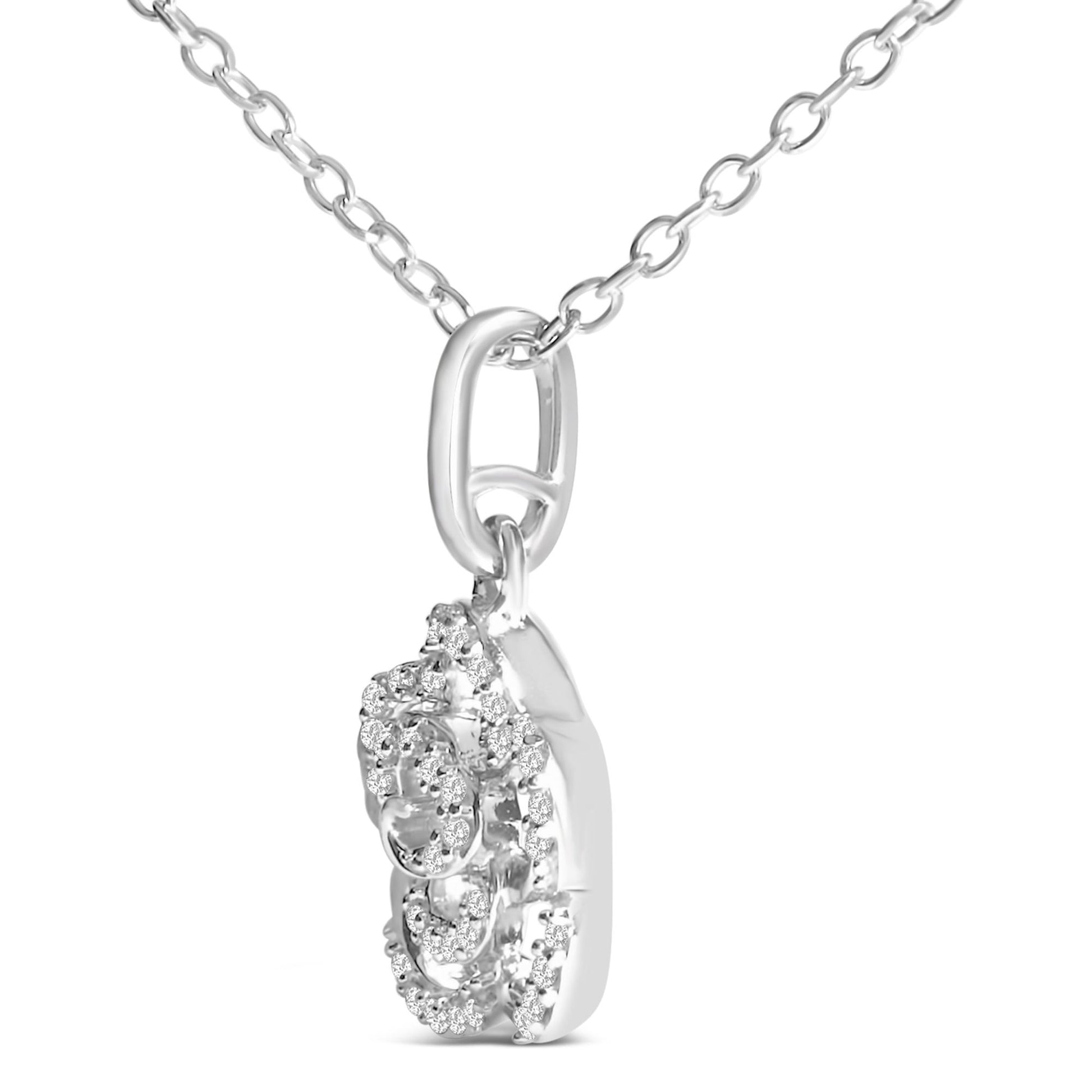 Close-up front angled view of a white metal necklace with a pendant featuring multiple small round white gemstones in prong settings, shown hanging on a chain.