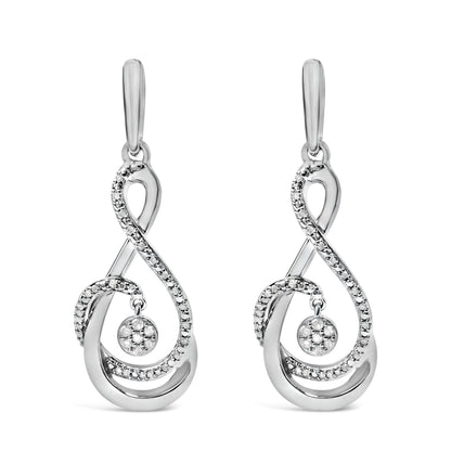 Front view of a pair of white metal earrings with a flowing, looping design accented by multiple round white gemstones in prong settings, including a central circular cluster that dangles.