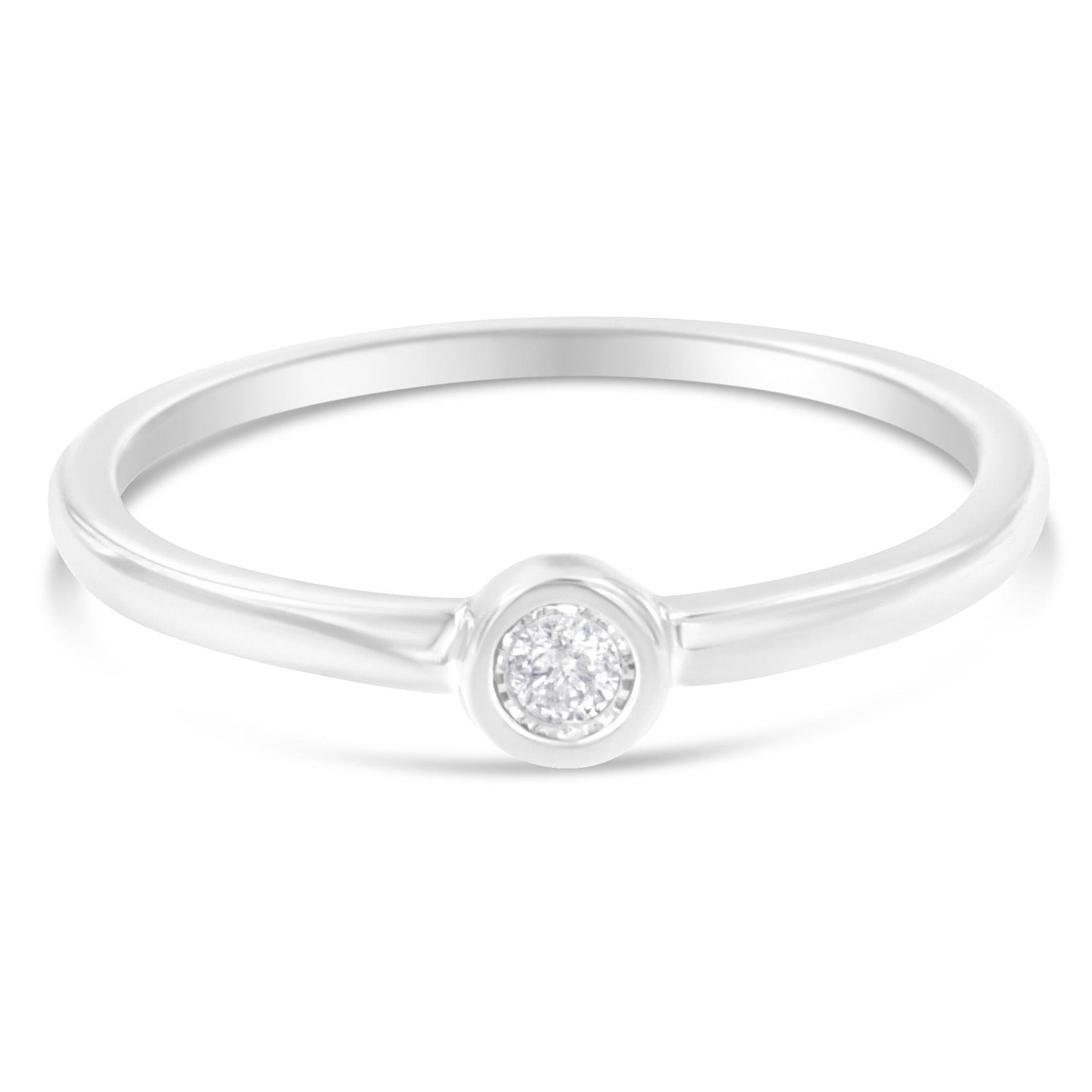 Front angle of a white metal ring with a single round white gemstone in a miracle setting.
