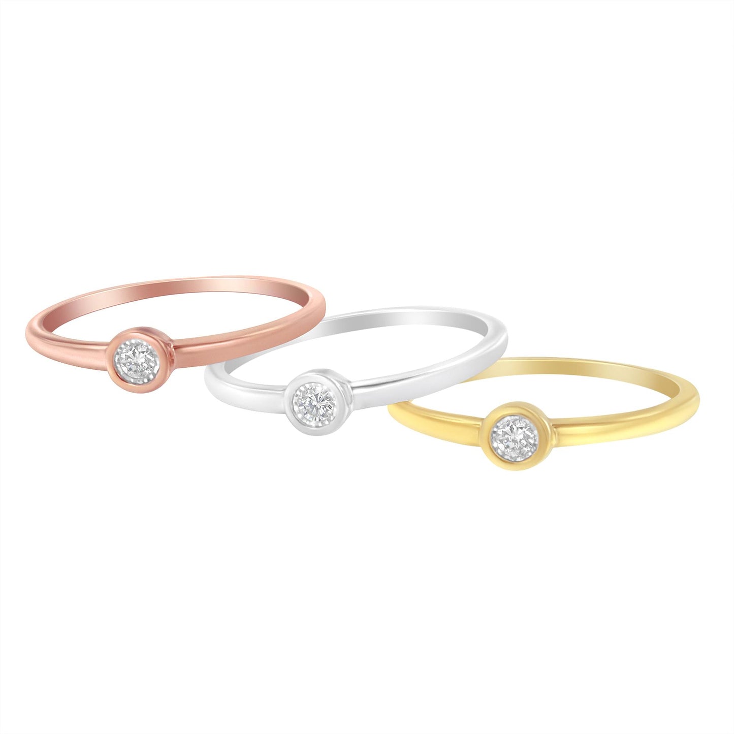 Three rings in yellow, white, and rose metal colors, each with a round white gemstone in a miracle setting, shown in a three-quarter angle view.