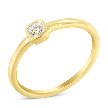 Close-up angle of a yellow metal ring with a single round white gemstone in a square miracle setting.