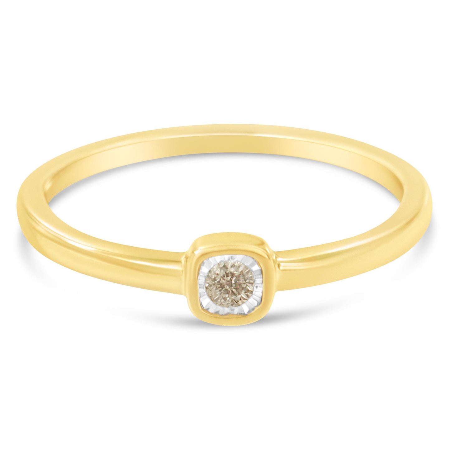 Yellow metal ring with a round white gemstone in a miracle setting, shown from a front angled view.