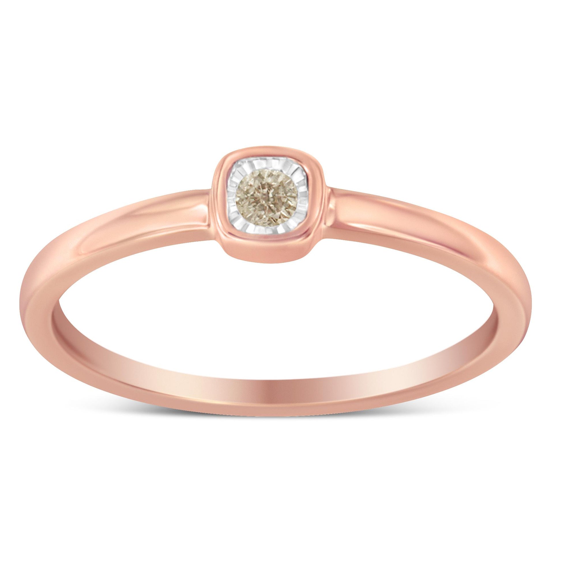 Front-facing view of a rose-colored ring with a single round white gemstone set in a square bezel with a miracle setting.
