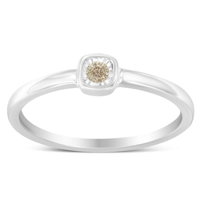 Front view of a white metal ring with a single round white gemstone in a miracle setting.