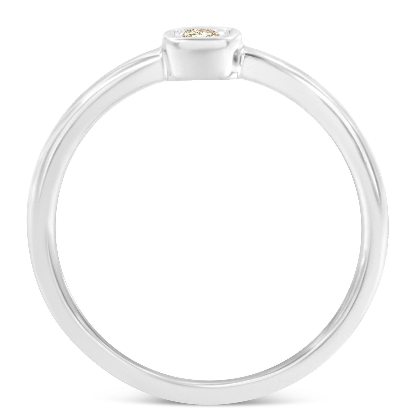 Top view of a white metal ring with a round white gemstone in a miracle setting.