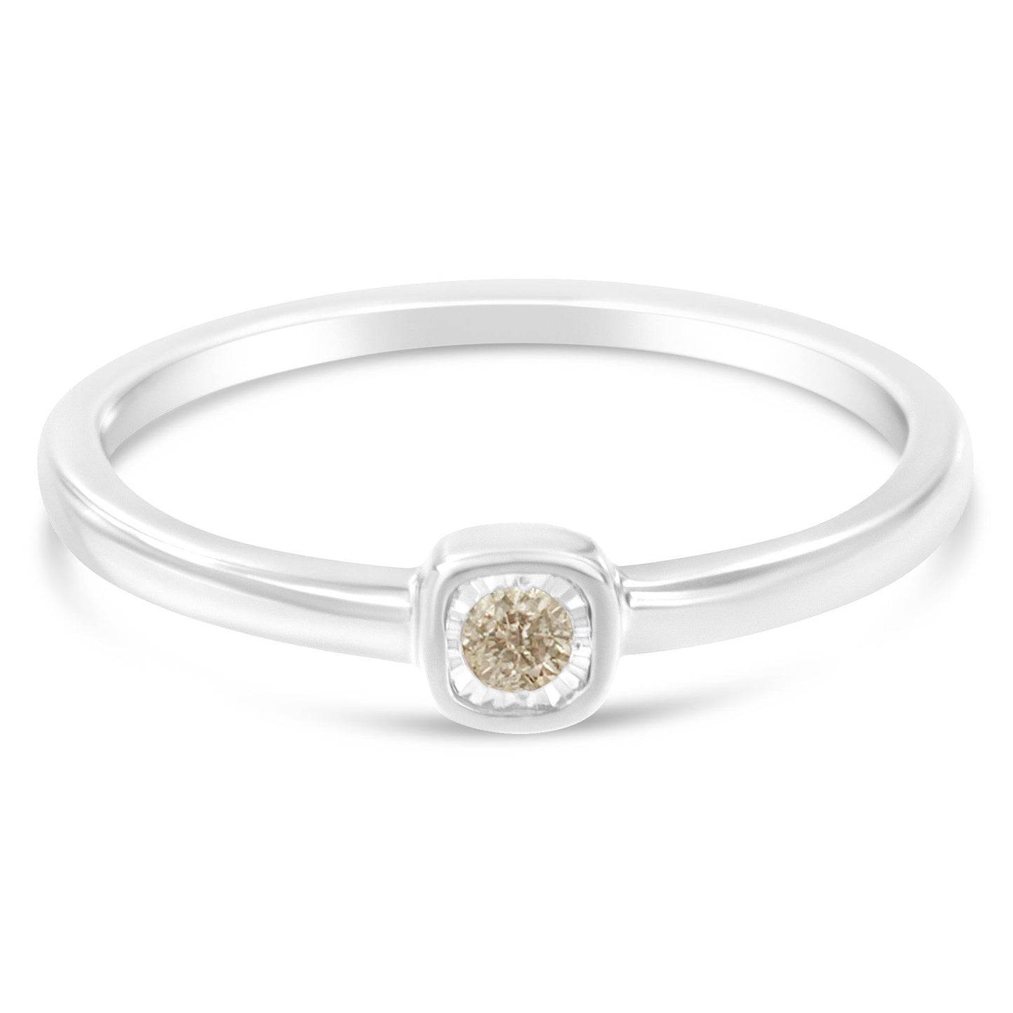 White metal ring with a round white gemstone in a miracle setting, shown from a front angle.