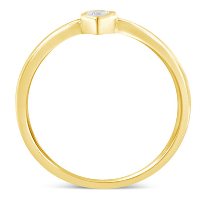 Top-down angled view of a yellow metal ring with a single round white gemstone in a miracle setting.