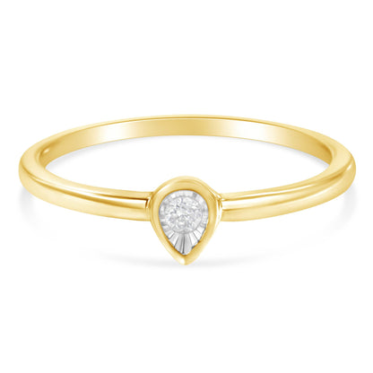Front angle view of a yellow ring featuring a round white gemstone in a miracle setting.