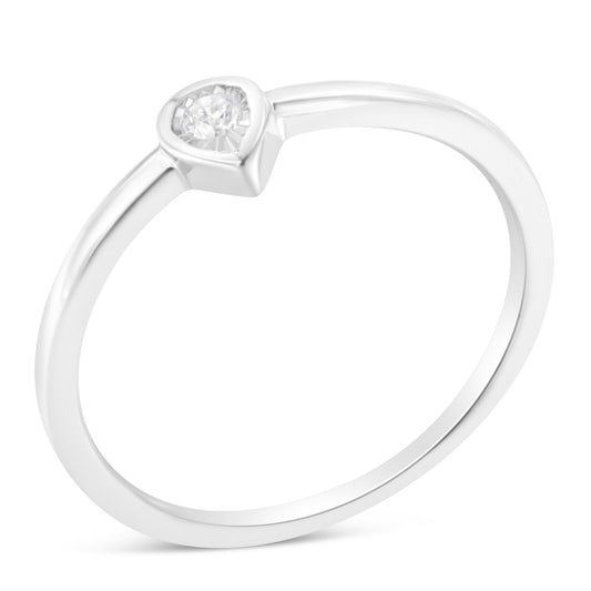 White metal ring with a round white gemstone in a miracle setting, shown at an angled top view.
