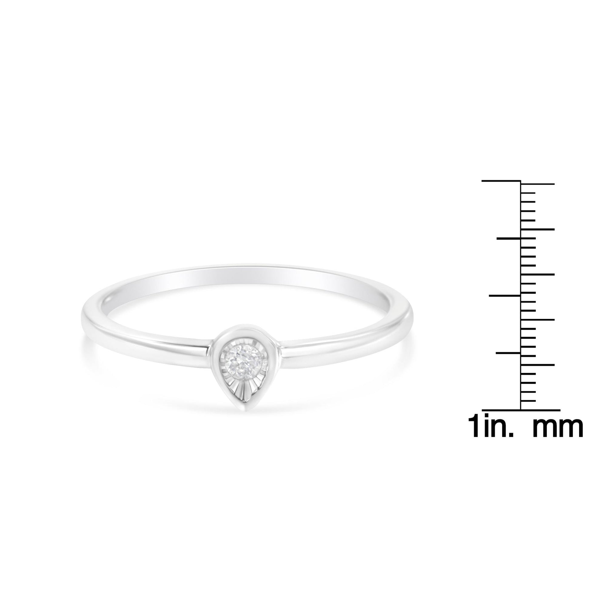 White metal ring with a round white gemstone in a pear-shaped setting, shown from the front with a ruler for size reference.