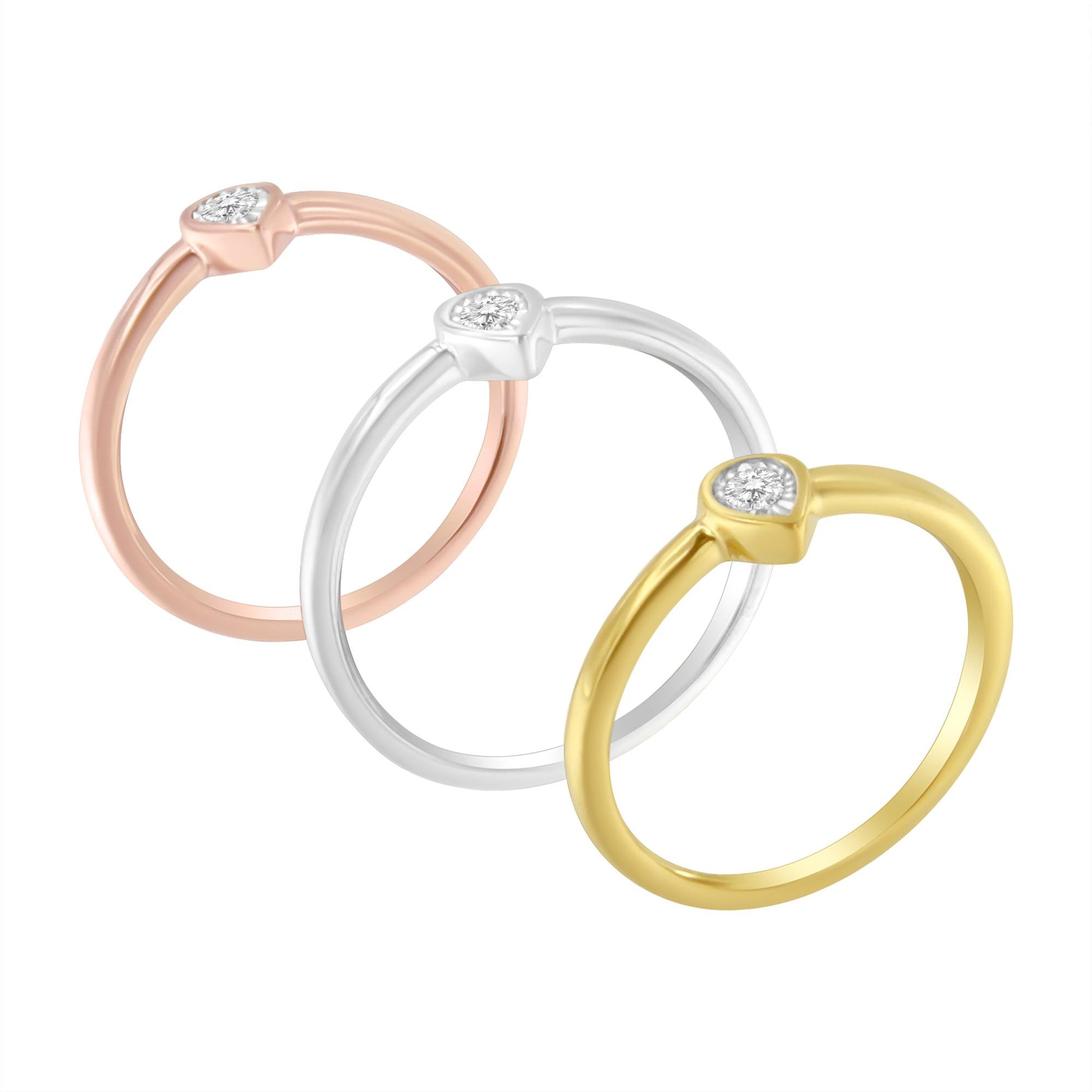 Three rings in yellow, white, and rose metal, each with a single round white gemstone in a miracle setting, shown from a slightly angled top view.