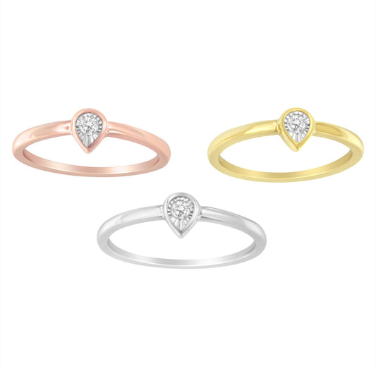 Front-facing view of three rings in yellow, white, and rose metal colors, each featuring a single round white gemstone in a miracle setting.