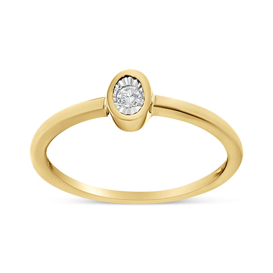 Yellow metal ring with a round white gemstone in a miracle setting, shown from a front angle on a white background.