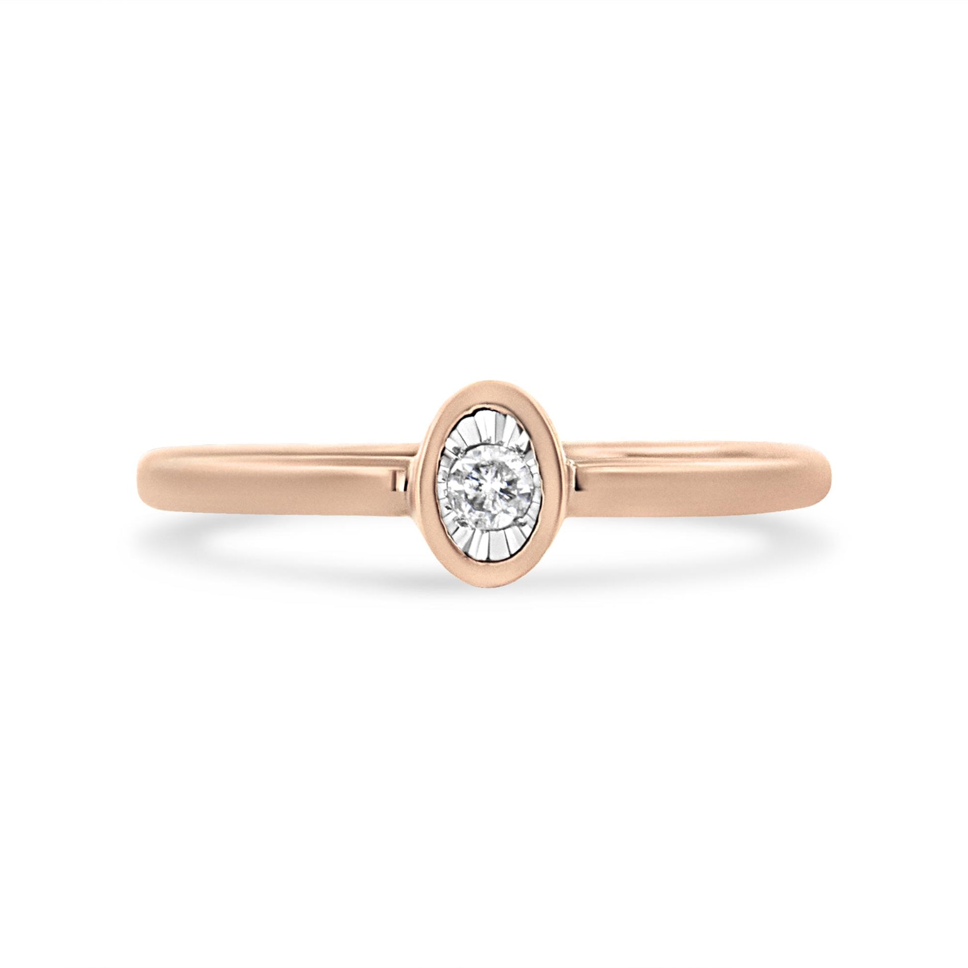 Front view of a rose metal ring with a single round white gemstone in a miracle setting.