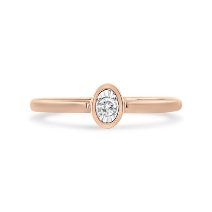 Front view of a rose metal ring with a single round white gemstone in a miracle setting.
