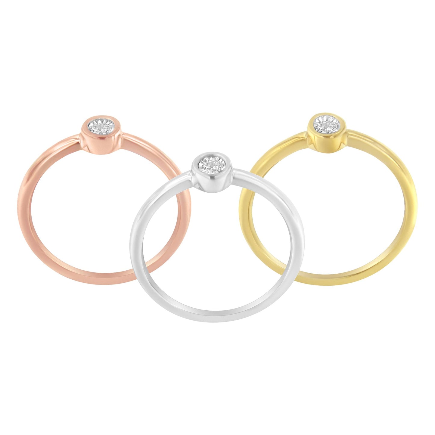 Front-facing view of three rings in yellow, white, and rose metal colors, each featuring a round white gemstone in miracle setting.