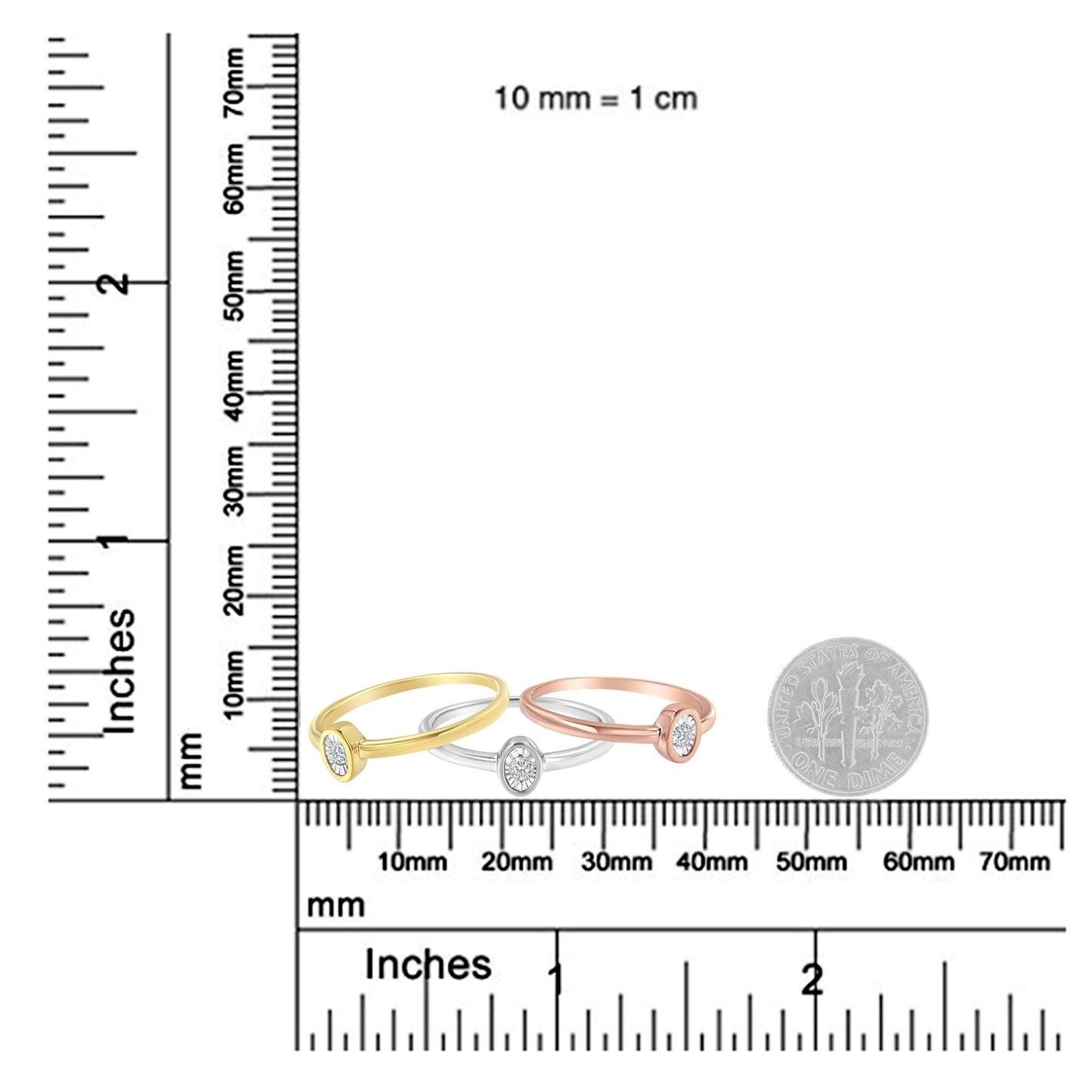 Three rings in yellow, white, and rose metal colors with round white gemstones in miracle settings, displayed on a ruler and scale for size reference, shot from the front angle.