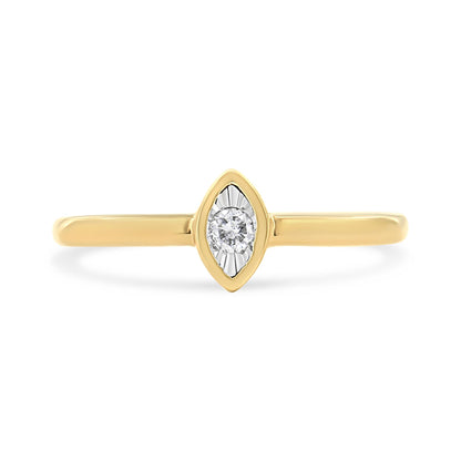 Front view of yellow metal ring with a round white gemstone in a marquise-shaped setting.