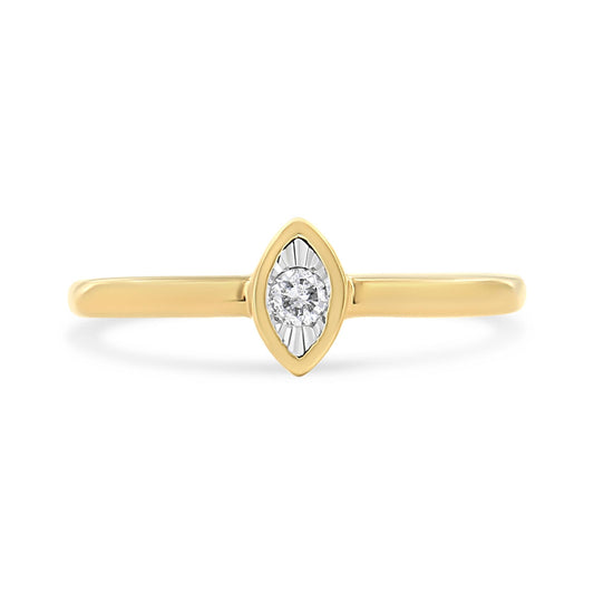 Front view of yellow metal ring with a round white gemstone in a marquise-shaped setting.