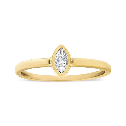 Front angle of a yellow ring featuring a single round white gemstone in a marquise-shaped setting.