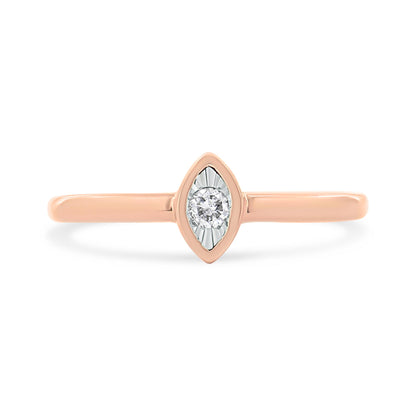 Front-facing view of a rose-colored ring featuring a single round white gemstone in a marquise-shaped setting.