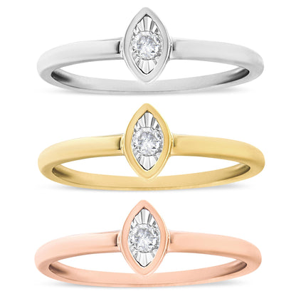 Three rings in a vertical row, viewed from the front, each with a round white gemstone set in a marquise-shaped setting; the bands are yellow, white, and rose metal colors.