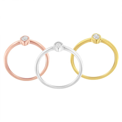 Three rings with yellow, white and rose metal colors, each featuring a round white gemstone in a miracle setting, shown from a top front angle.